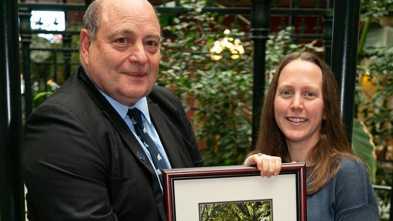 Emily Thomas with Steve Grado, vice president of the Penn State Forest Resources 校友 Group.